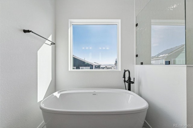 bathroom with a tub