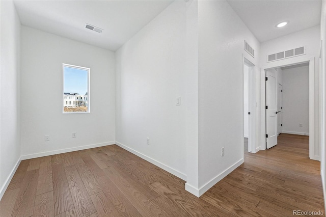 empty room featuring wood-type flooring