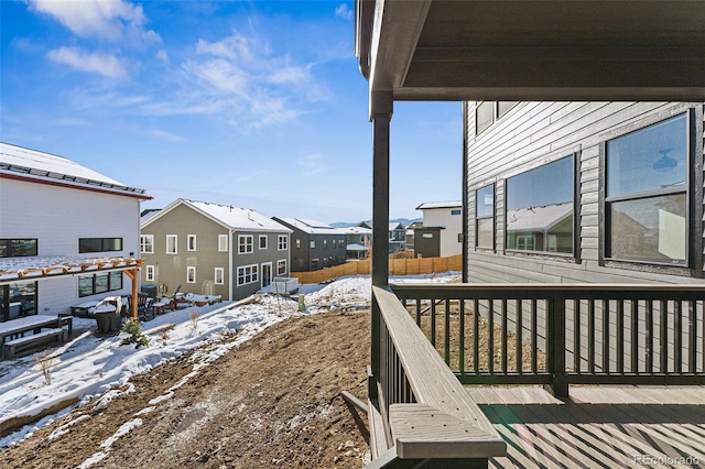 snowy yard featuring a deck