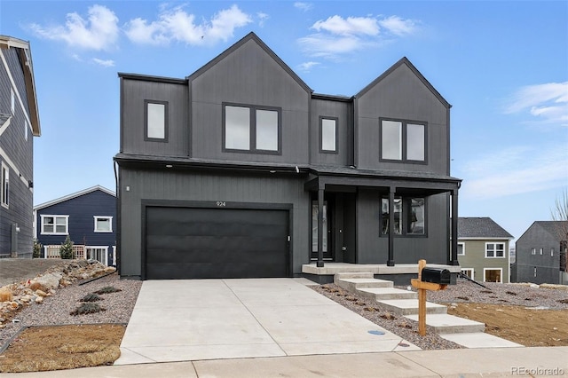 view of front of home with a garage, a porch, and concrete driveway