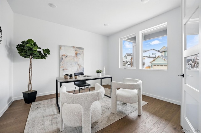 office space featuring baseboards and dark wood-type flooring