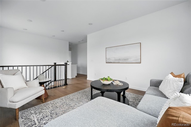 living room featuring baseboards and wood finished floors