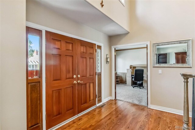 2154 S Parfet Dr, Lakewood, CO 80227 - foyer with light wood-style floors and baseboards