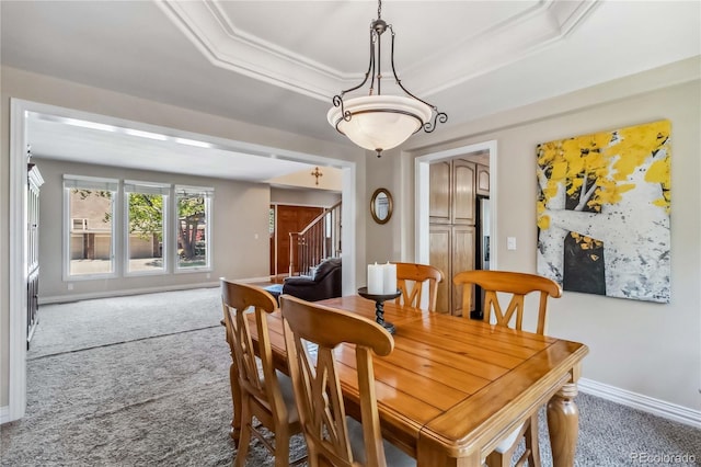 2154 S Parfet Dr, Lakewood, CO 80227 - carpeted dining area featuring a raised ceiling, stairs, and baseboards