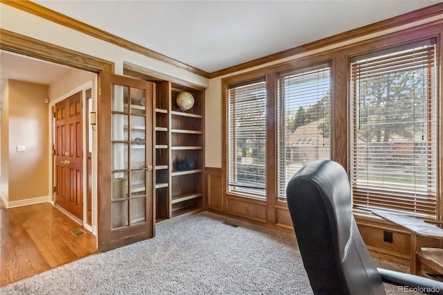2154 S Parfet Dr, Lakewood, CO 80227 - home office with plenty of natural light, french doors, crown molding, carpet, and a wainscoted wall