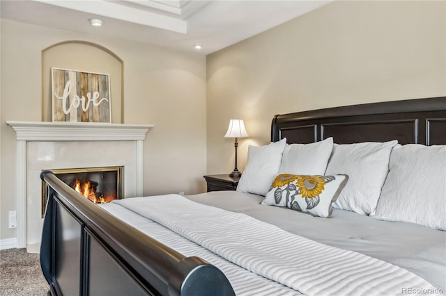 2154 S Parfet Dr, Lakewood, CO 80227 - carpeted bedroom with recessed lighting, a glass covered fireplace, and baseboards