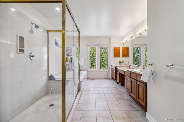 2154 S Parfet Dr, Lakewood, CO 80227 - bathroom with a stall shower, double vanity, and tile patterned flooring