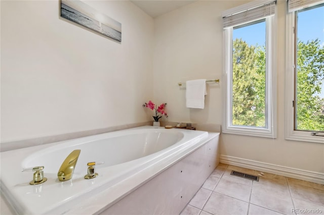 2154 S Parfet Dr, Lakewood, CO 80227 - bathroom featuring plenty of natural light, tile patterned floors, a bath, and baseboards