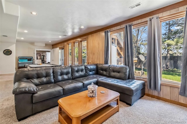 2154 S Parfet Dr, Lakewood, CO 80227 - living area featuring light carpet, plenty of natural light, recessed lighting, baseboards, and wooden walls