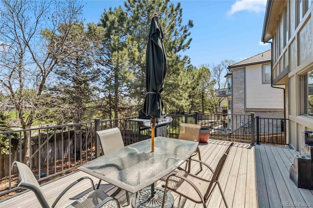 2154 S Parfet Dr, Lakewood, CO 80227 - wooden deck featuring outdoor dining area