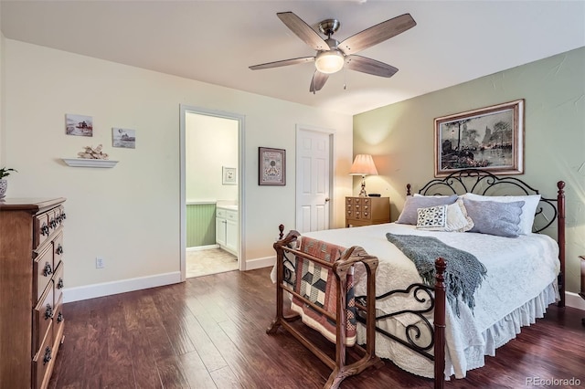 bedroom with connected bathroom, ceiling fan, baseboards, and dark wood-style flooring