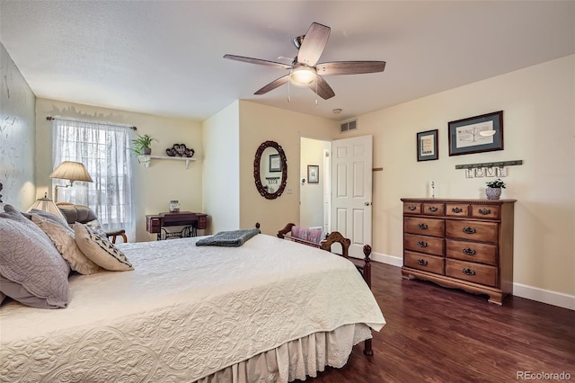 bedroom with visible vents, baseboards, a ceiling fan, and dark wood-style flooring