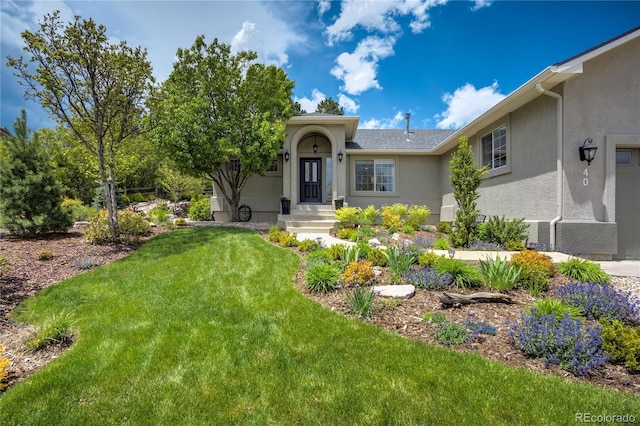 40 Wuthering Heights Dr, Colorado Springs, CO 80921 - view of front of home with stucco siding and a front yard