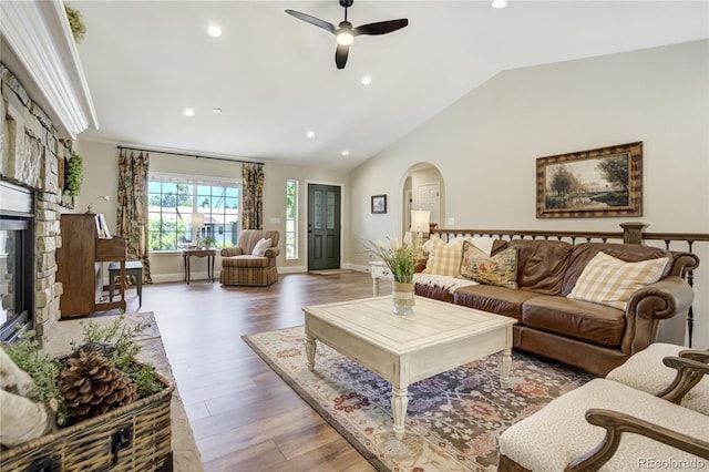 40 Wuthering Heights Dr, Colorado Springs, CO 80921 - living area with arched walkways, recessed lighting, ceiling fan, wood finished floors, and lofted ceiling