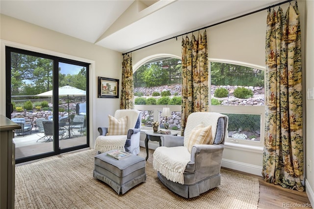 40 Wuthering Heights Dr, Colorado Springs, CO 80921 - living area with vaulted ceiling, wood finished floors, and baseboards