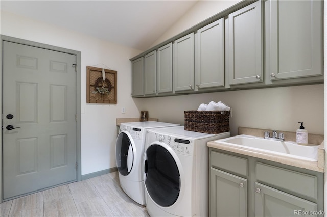 40 Wuthering Heights Dr, Colorado Springs, CO 80921 - laundry area featuring cabinet space, independent washer and dryer, light wood finished floors, and baseboards
