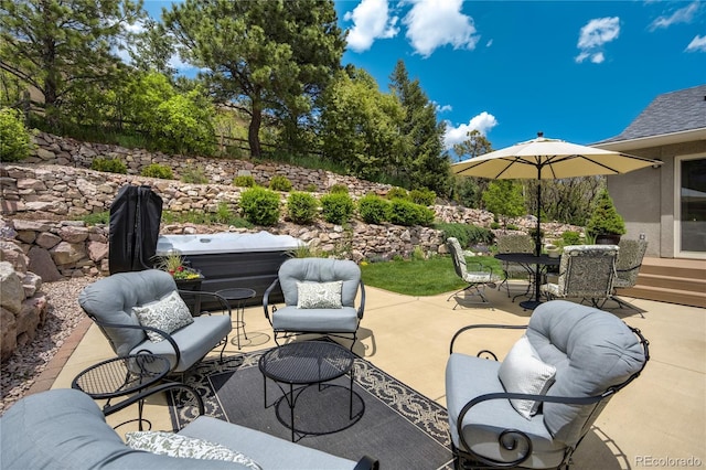 40 Wuthering Heights Dr, Colorado Springs, CO 80921 - view of patio with an outdoor hangout area, outdoor dining area, and a covered hot tub