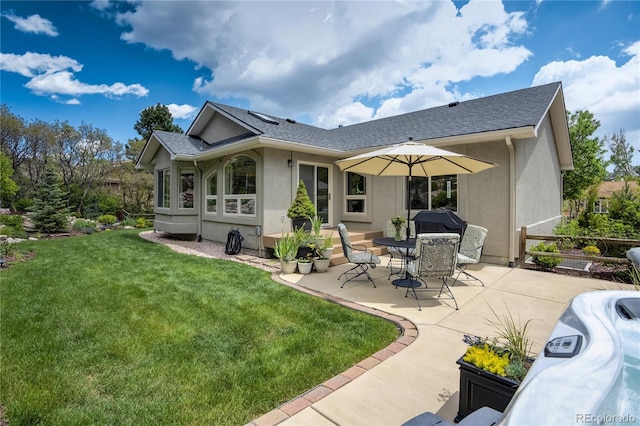 40 Wuthering Heights Dr, Colorado Springs, CO 80921 - back of house featuring a patio, stucco siding, a lawn, and a shingled roof