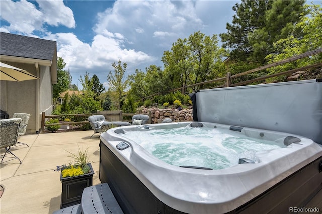40 Wuthering Heights Dr, Colorado Springs, CO 80921 - view of patio featuring a hot tub and view of wooded area
