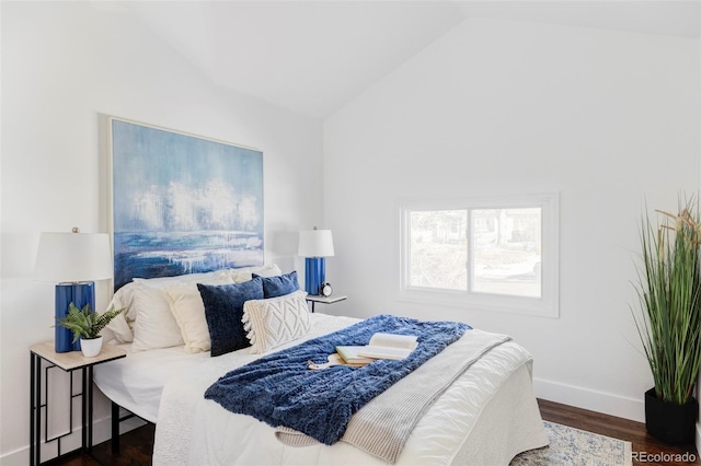 bedroom featuring vaulted ceiling and dark hardwood / wood-style floors