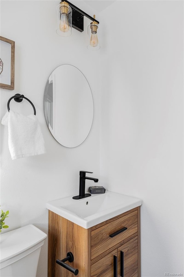 bathroom with vanity and toilet