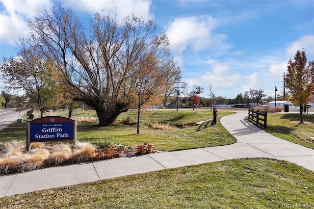 view of home's community with a yard