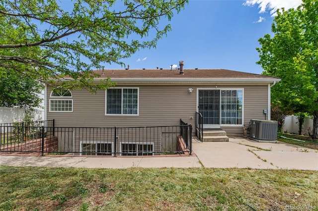 5403 Odessa St, Denver, CO 80249 - rear view of property with central air condition unit, fence, a patio area, and entry steps