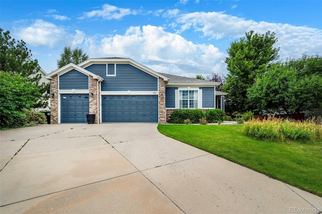 view of front facade with a garage and a front yard