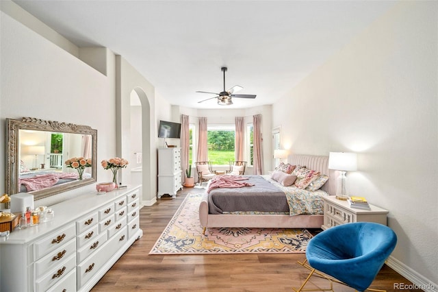 bedroom featuring ceiling fan and hardwood / wood-style flooring