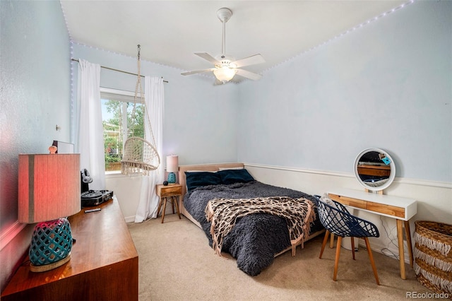 bedroom with ceiling fan and light colored carpet