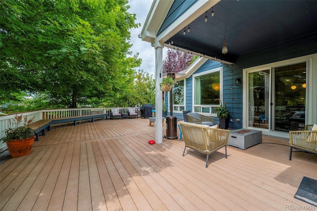 deck with an outdoor fire pit