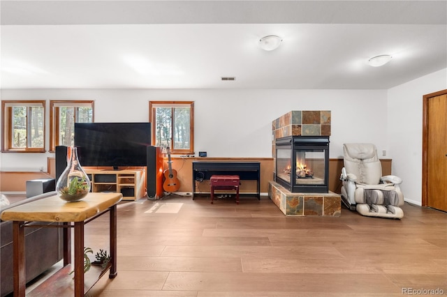25531 Mosier Cir, Conifer, CO 80433 - living area with a fireplace and wood finished floors