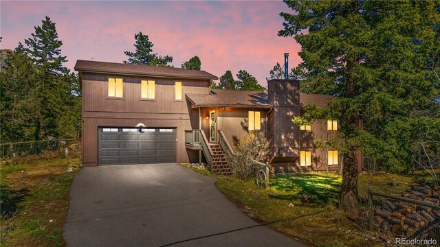 25531 Mosier Cir, Conifer, CO 80433 - view of front of home featuring driveway and a garage