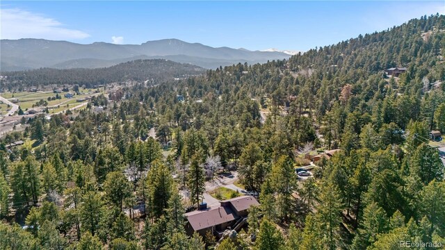 25531 Mosier Cir, Conifer, CO 80433 - view of property location featuring a forest and a mountainous background