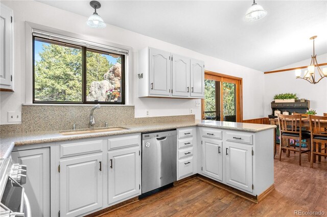 25531 Mosier Cir, Conifer, CO 80433 - kitchen with stainless steel dishwasher, a sink, vaulted ceiling, dark wood-style flooring, and a chandelier