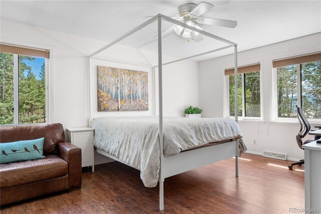25531 Mosier Cir, Conifer, CO 80433 - bedroom with wood finished floors, baseboards, and ceiling fan