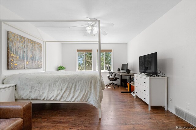 25531 Mosier Cir, Conifer, CO 80433 - bedroom featuring wood finished floors, an office area, and a ceiling fan