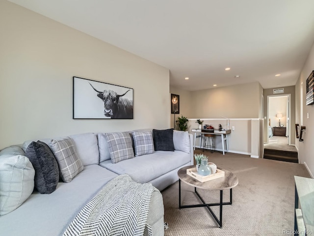 carpeted living room featuring recessed lighting, visible vents, and baseboards