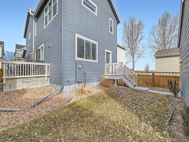 rear view of house with fence