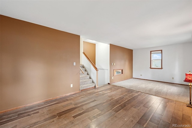 1617 W Boulder St, Colorado Springs, CO 80904 - spare room with wood-type flooring, stairway, and baseboards