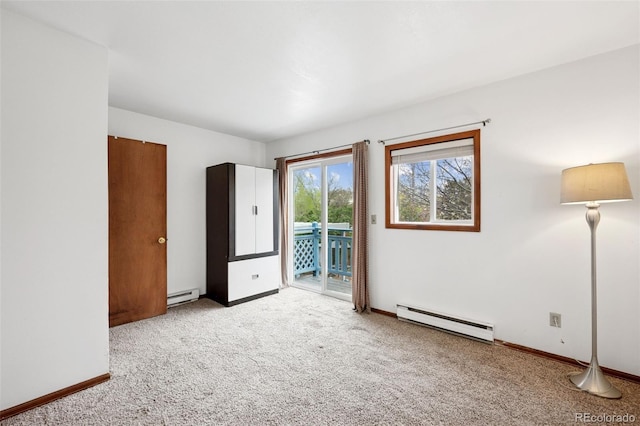 1617 W Boulder St, Colorado Springs, CO 80904 - unfurnished bedroom with a baseboard radiator, access to exterior, and carpet