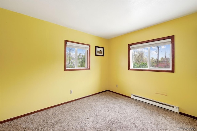 1617 W Boulder St, Colorado Springs, CO 80904 - carpeted spare room with baseboard heating, plenty of natural light, and baseboards
