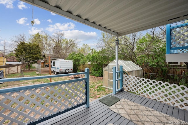 1617 W Boulder St, Colorado Springs, CO 80904 - wooden deck with an exterior structure, an outbuilding, and fence