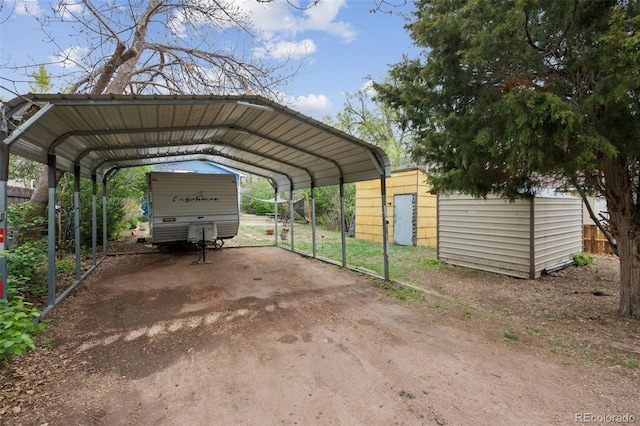 1617 W Boulder St, Colorado Springs, CO 80904 - view of parking featuring fence and a carport
