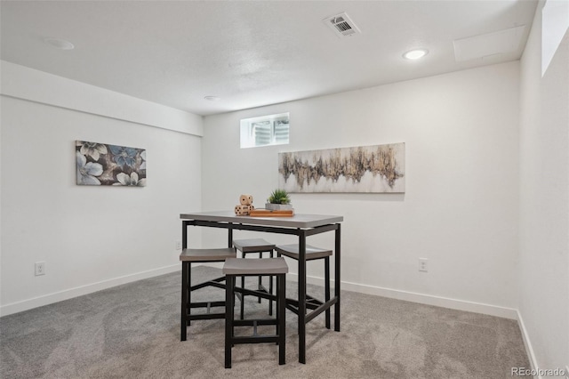 dining area with carpet floors, baseboards, and visible vents