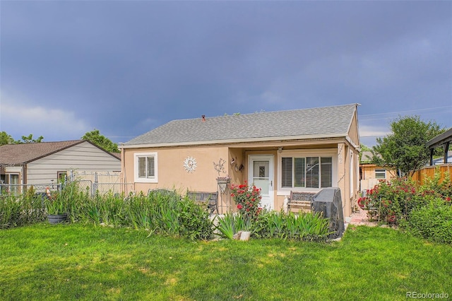 6736 Grove St, Denver, CO 80221 - view of front of property featuring stucco siding and a shingled roof