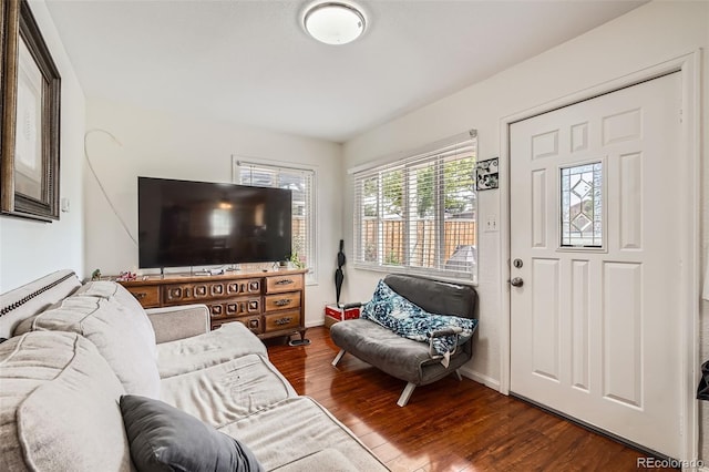 6736 Grove St, Denver, CO 80221 - living area featuring dark wood-style floors and baseboards