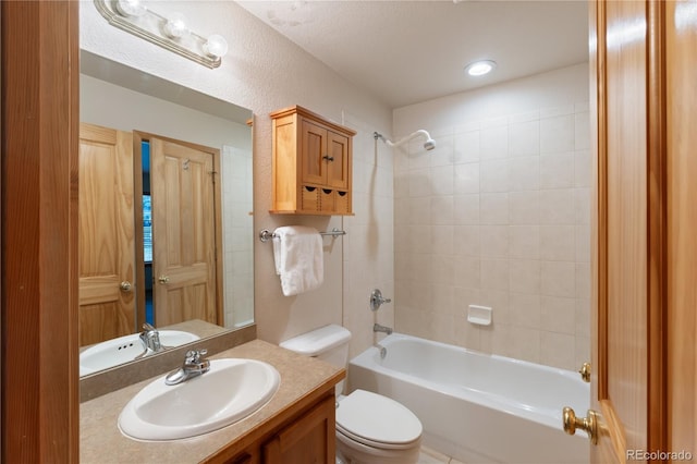 bathroom with vanity, toilet, and bathing tub / shower combination