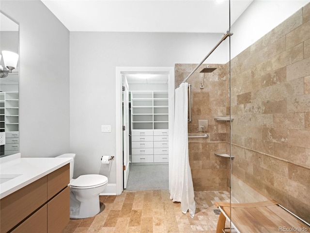 bathroom with vanity, toilet, and a shower with shower curtain