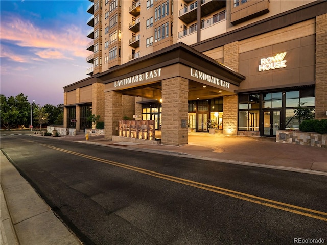 view of outdoor building at dusk